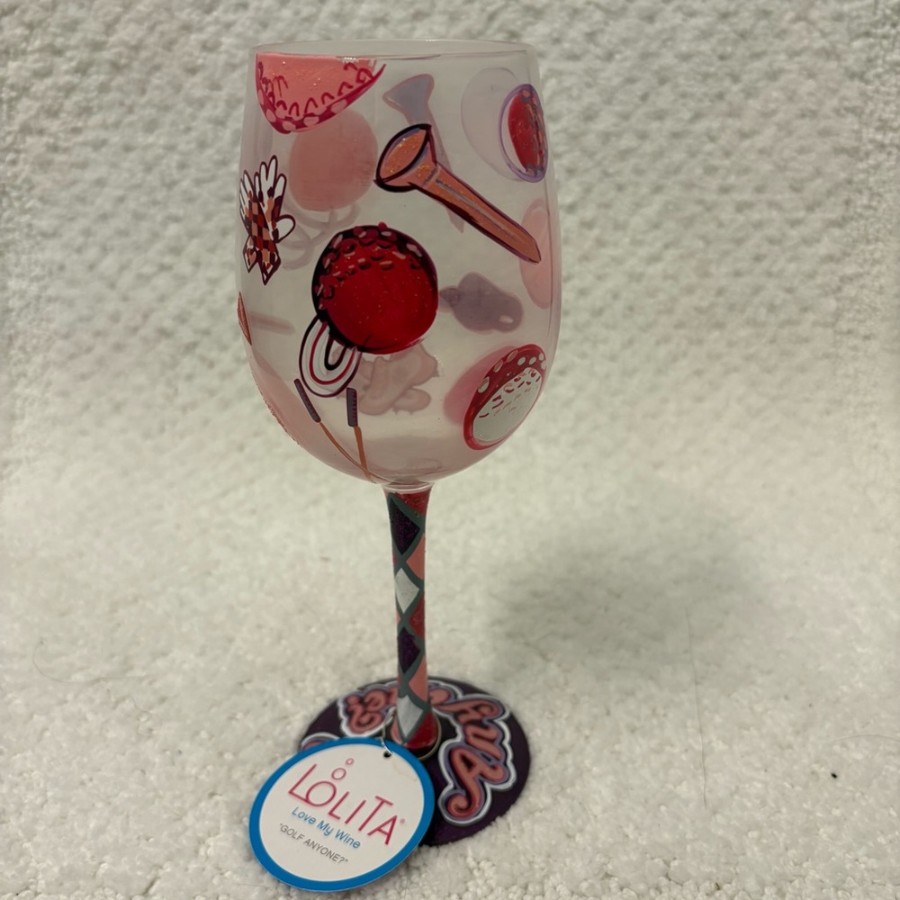 Lolita Handpainted wine glass “Golf Anyone” pink purple golf icons NWT